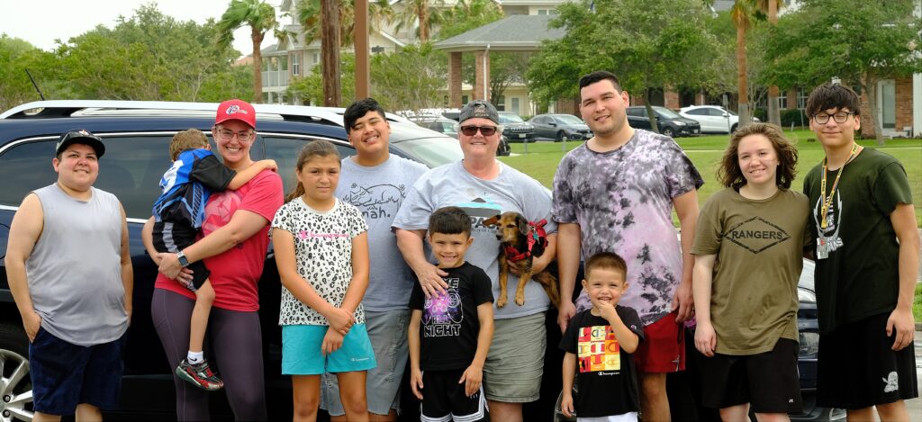 2023 St Paul Youth and Teen Car Wash -- Pastor Dana and Student Pastor Eli with youth --cleaned auction winner's car